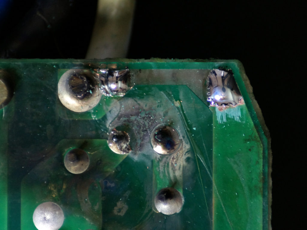 soldered ends of damaged pcb trace